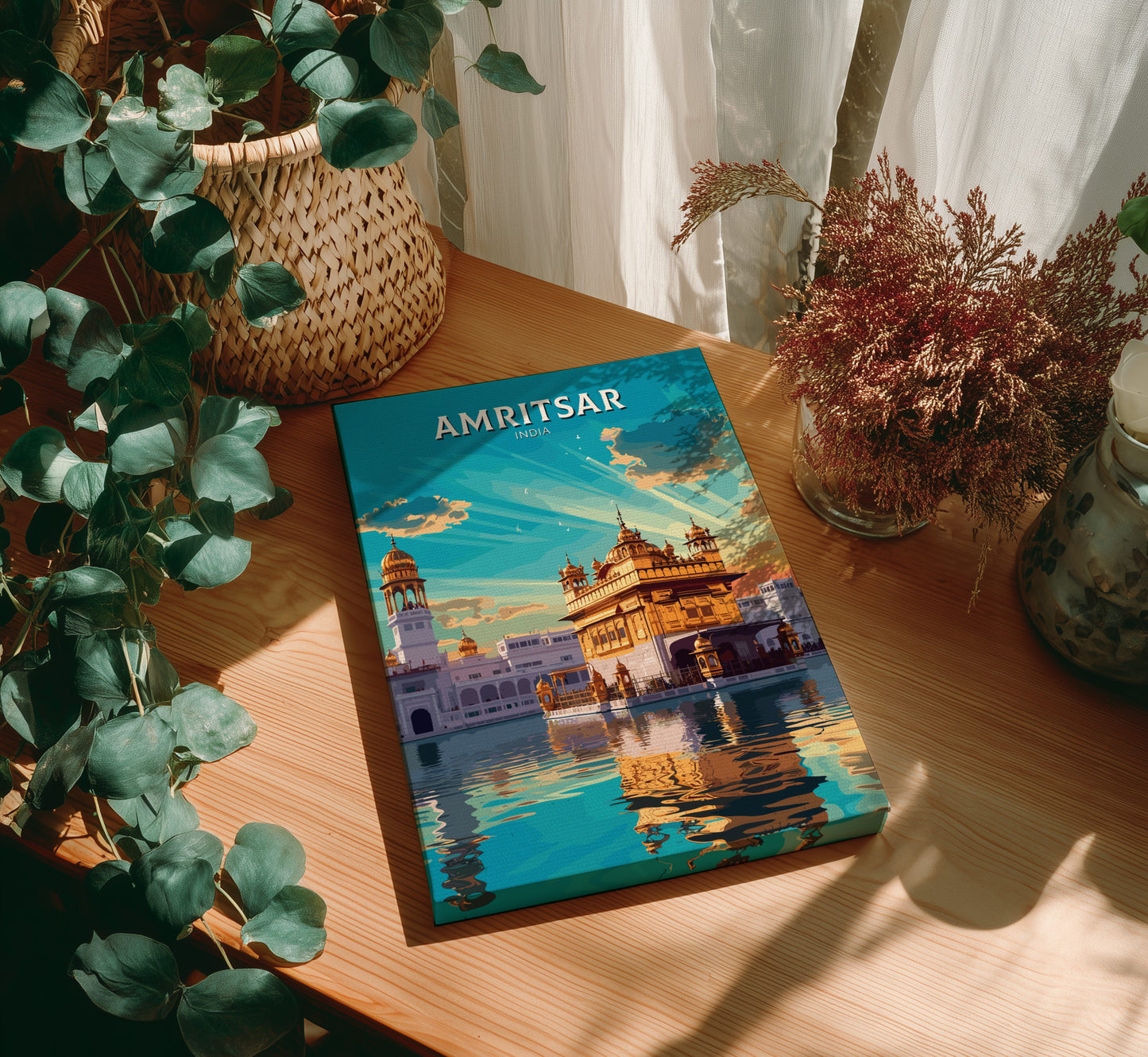 Book titled 'Amritsar' on a wooden table with decorative plants.