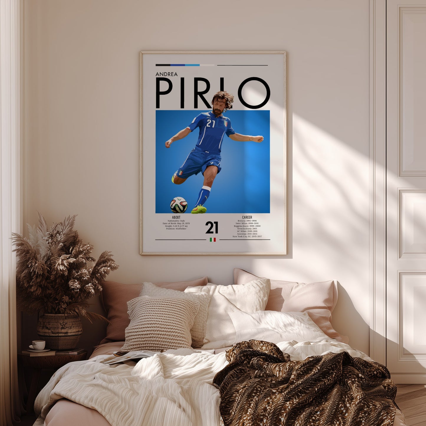 Framed poster of Andrea Pirlo above a bed in a bedroom