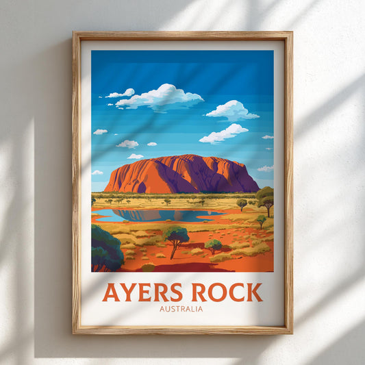 Framed artwork of Ayers Rock, Australia on a white wall.