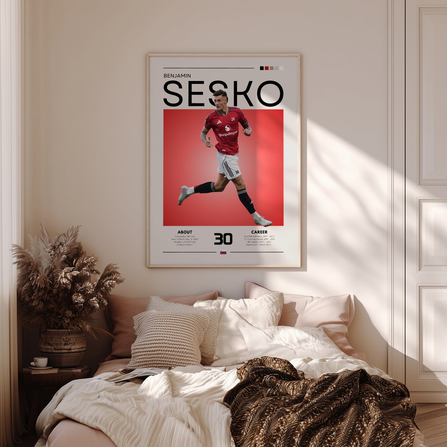 Poster of a soccer player named Sesko on a wall above a bed in a bedroom.