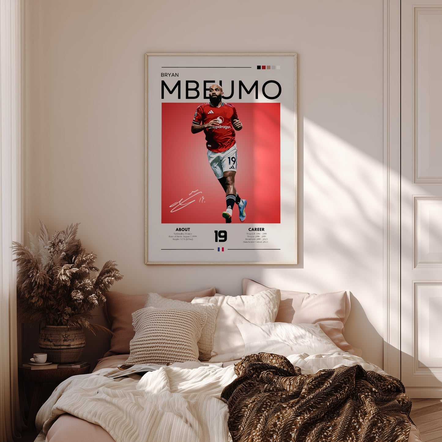 Framed sports poster of a player on a wall above a bed in a bedroom.