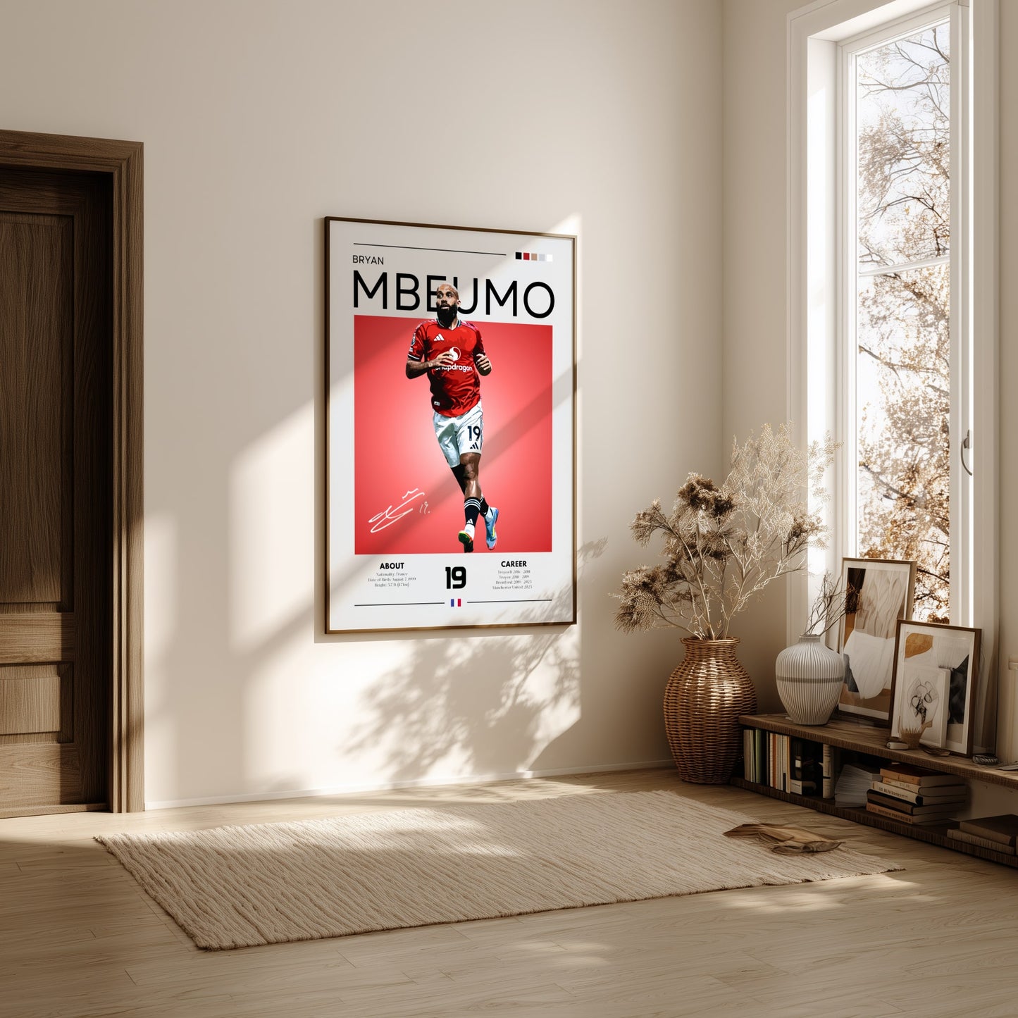 Framed sports poster of a player on a wall in a bright room with natural light.