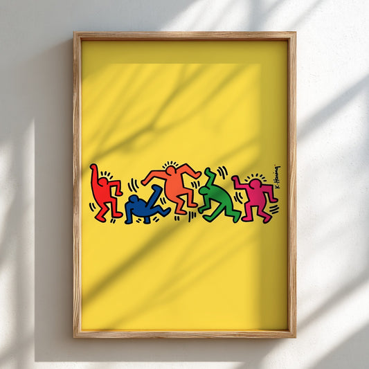 Keith Haring "Dancing Figures" poster with colorful figures on a yellow background.