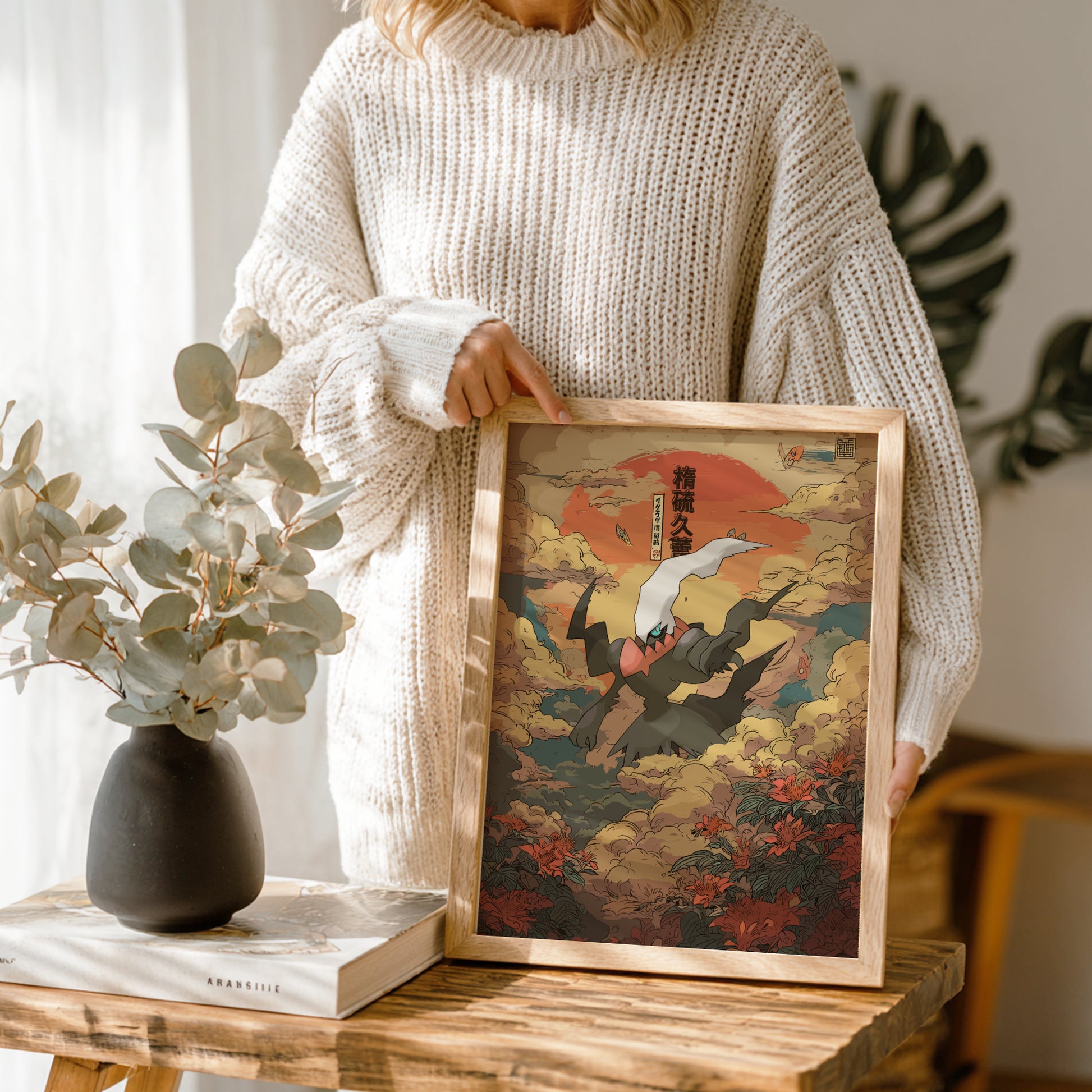 Person holding a framed artwork with a nature setting of Darkrai Pokemon