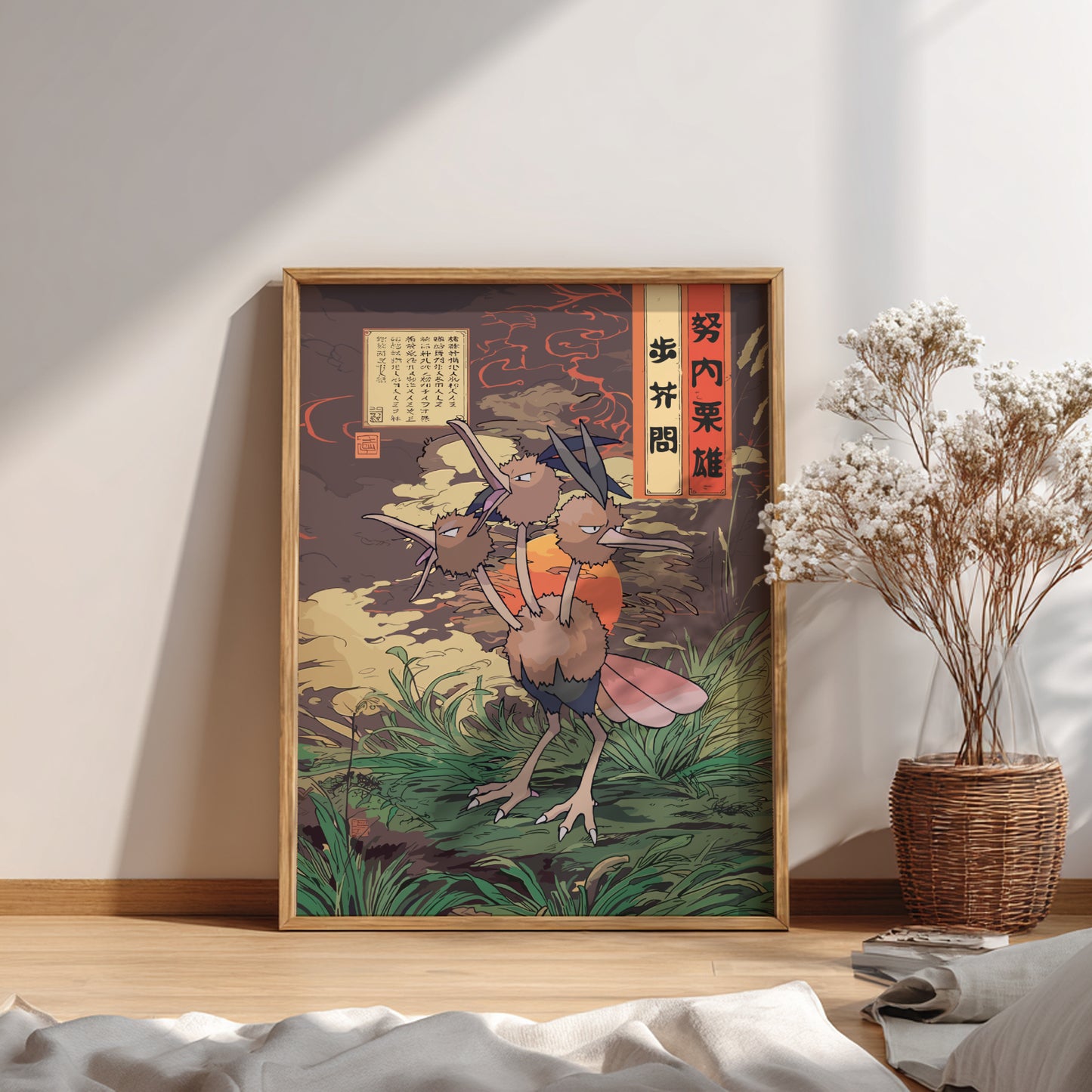 Framed artwork of a stylized Dodrio Pokemon character on a wall with a plant and decor items below.