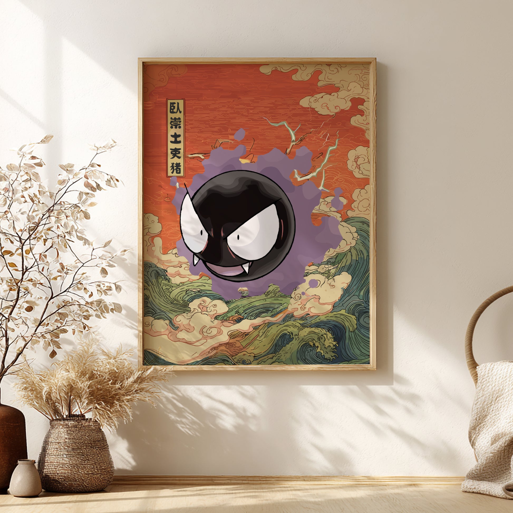 Framed artwork with a stylized Gastly Pokemon on a red background, placed on a wall with decorative elements.