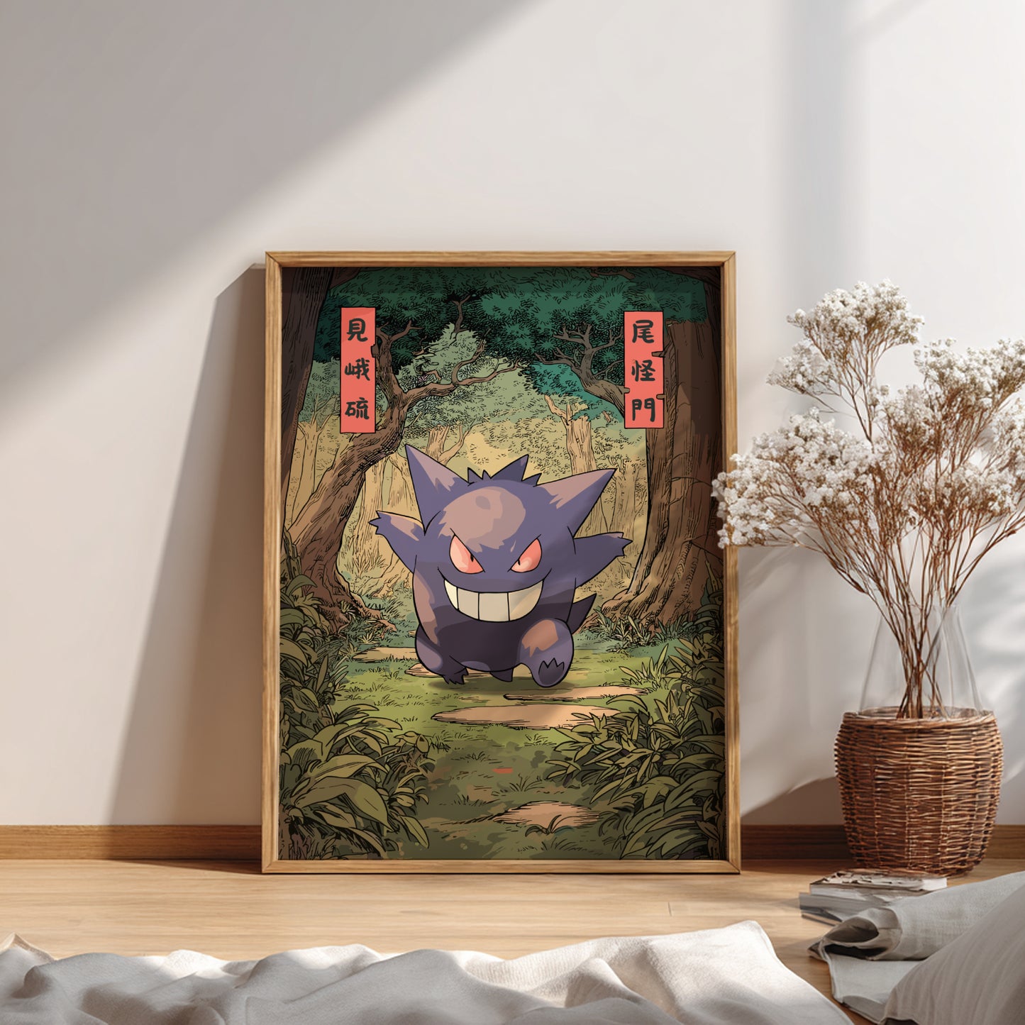 Framed artwork of Gengar Pokémon character in a forest setting on a wall.