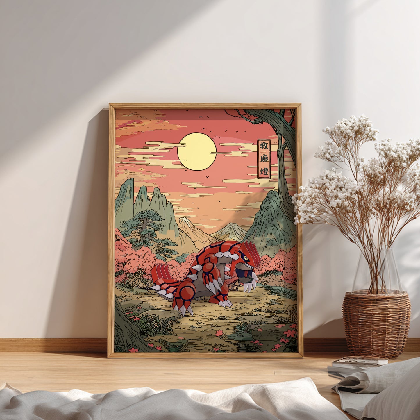 Framed artwork of a Groudon Pokemon in a mountainous landscape with a wicker basket and dried plants on a wooden floor.