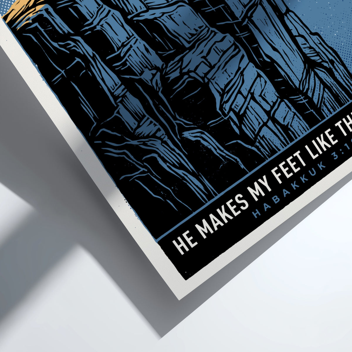 Poster featuring a deer standing on a high cliff under a blue sky.