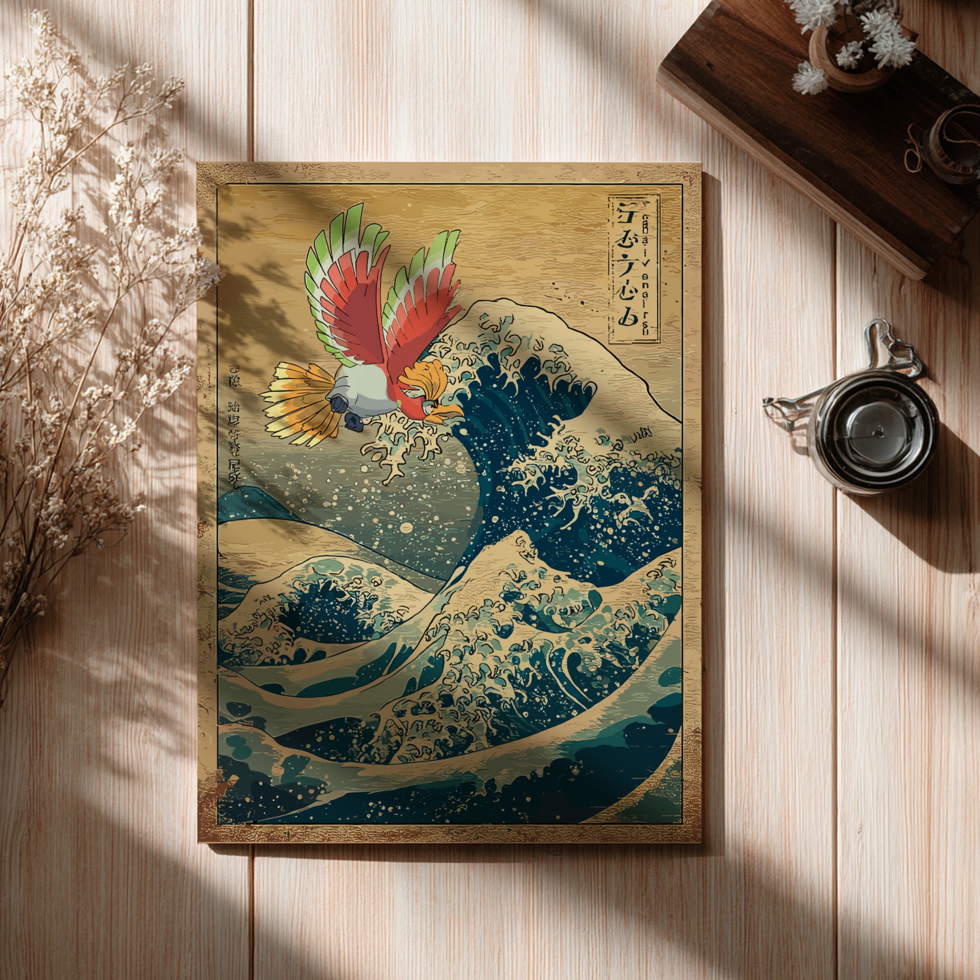 Framed artwork of Ho-Oh Pokemon on a wave with Japanese text, placed on a wooden surface.