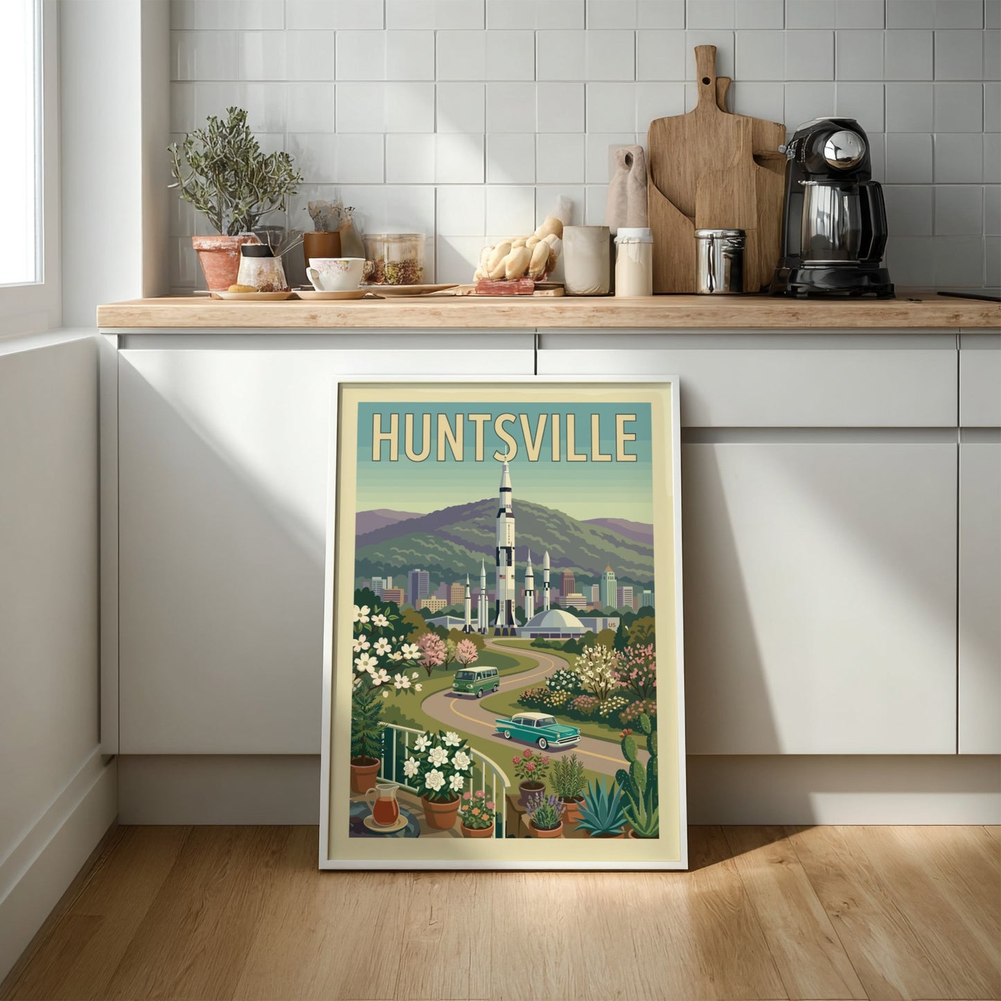 Huntsville Rocket City poster featuring a Saturn V rocket, vintage cars, and retro cityscape in a warm,