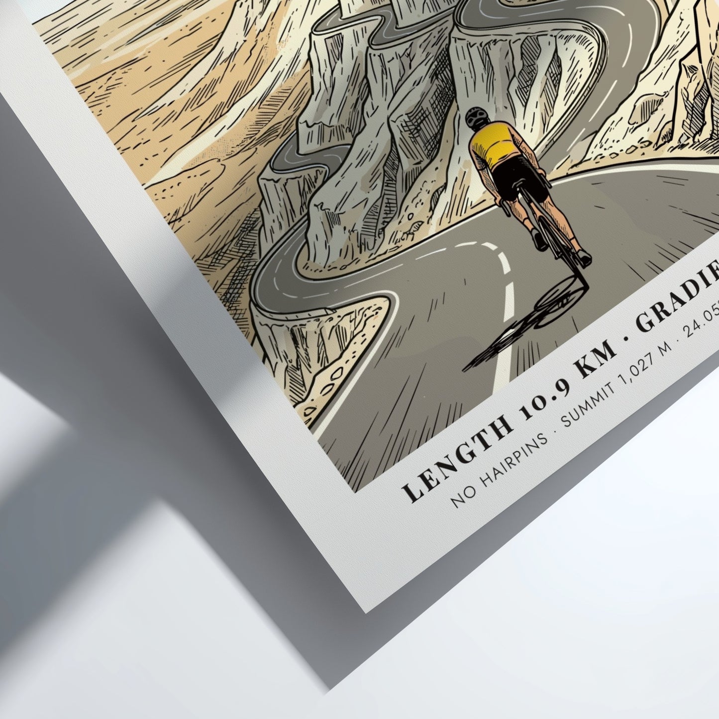 Poster of a cyclist riding up the winding Jebel Hafeet mountain road in Abu Dhabi