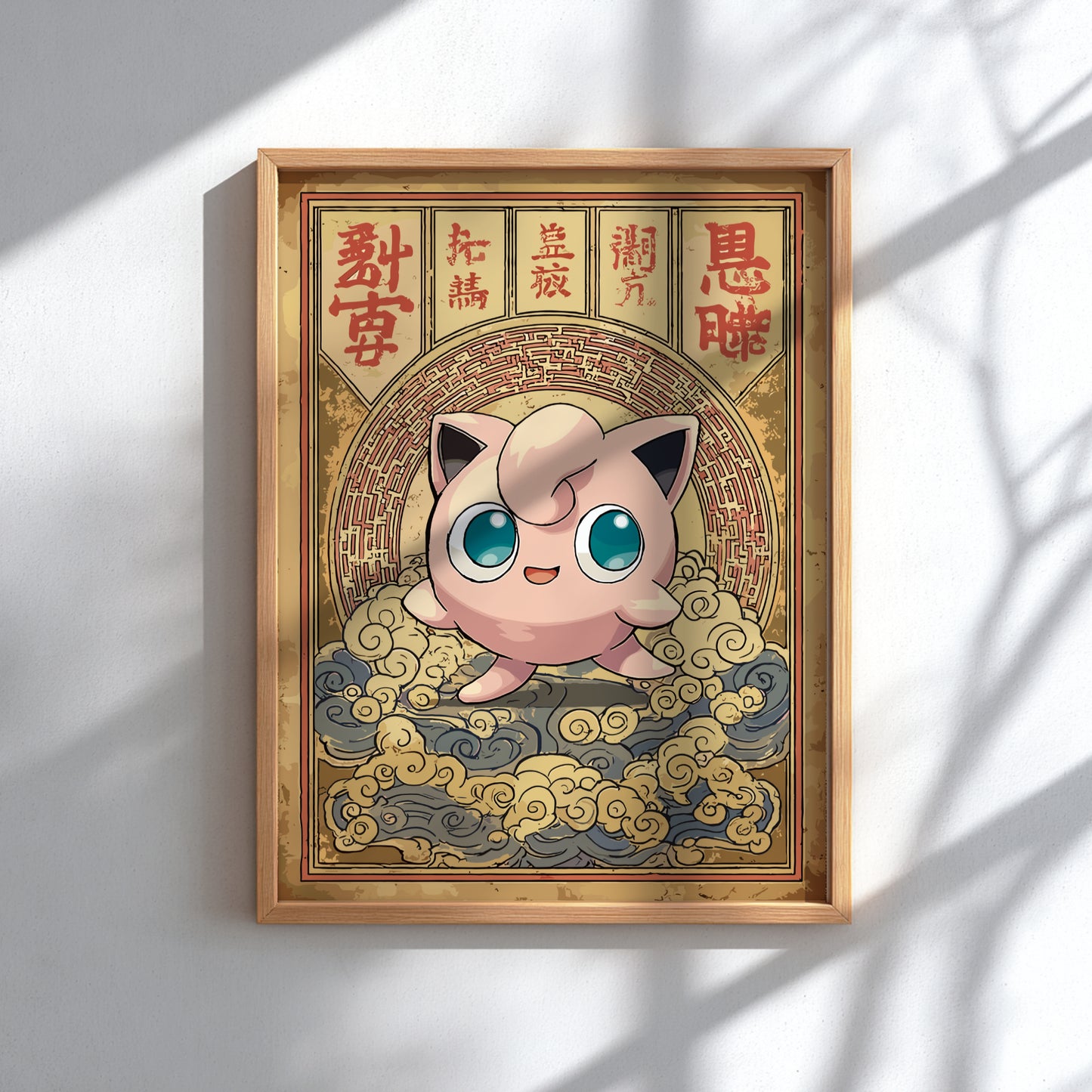 Framed artwork of Jigglypuff Pokemon character with a gold border on a white wall.