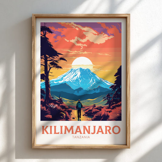 Framed poster of Mount Kilimanjaro with a person looking at the mountain, set against a colorful sky.