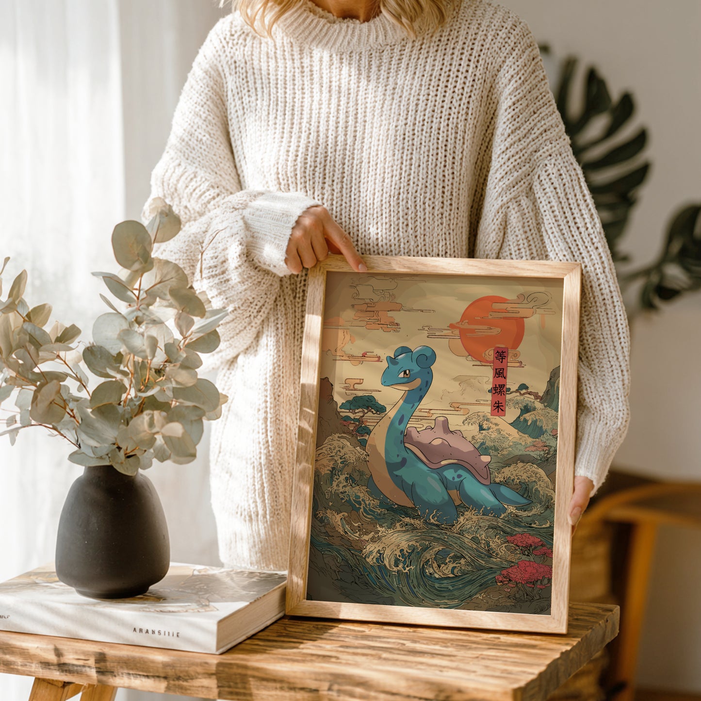Person holding a framed artwork of Lapras Pokemon in a natural setting