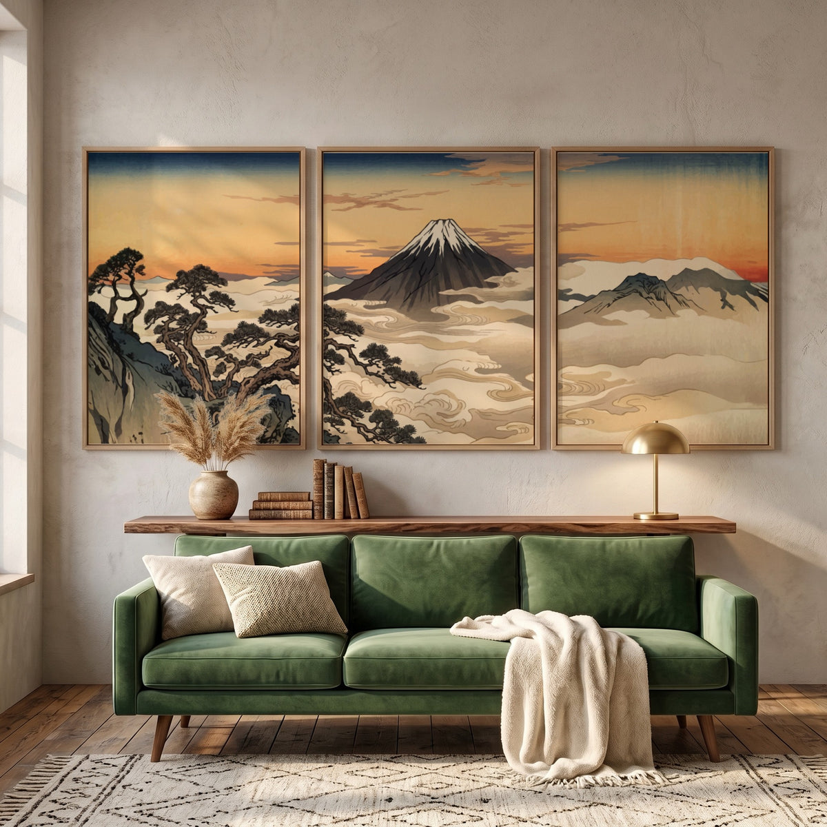 Three framed Japanese landscape prints featuring Mount Fuji rising above clouds at sunset