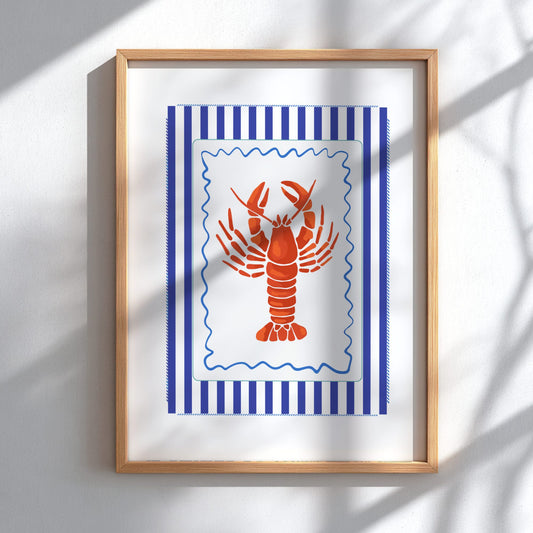 Framed artwork with a red lobster on a blue striped background