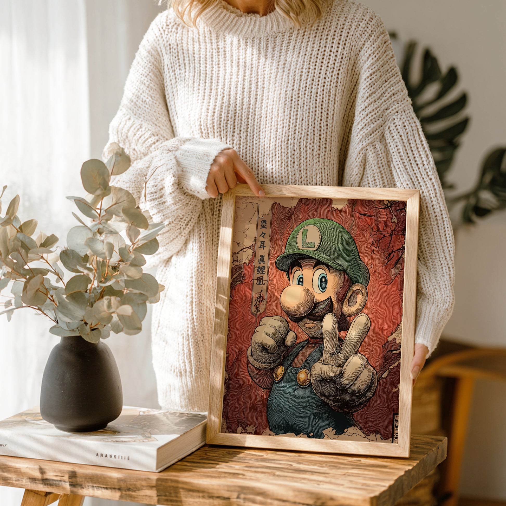 Person holding a framed illustration of Luigi character, standing in a room with plants and decor.