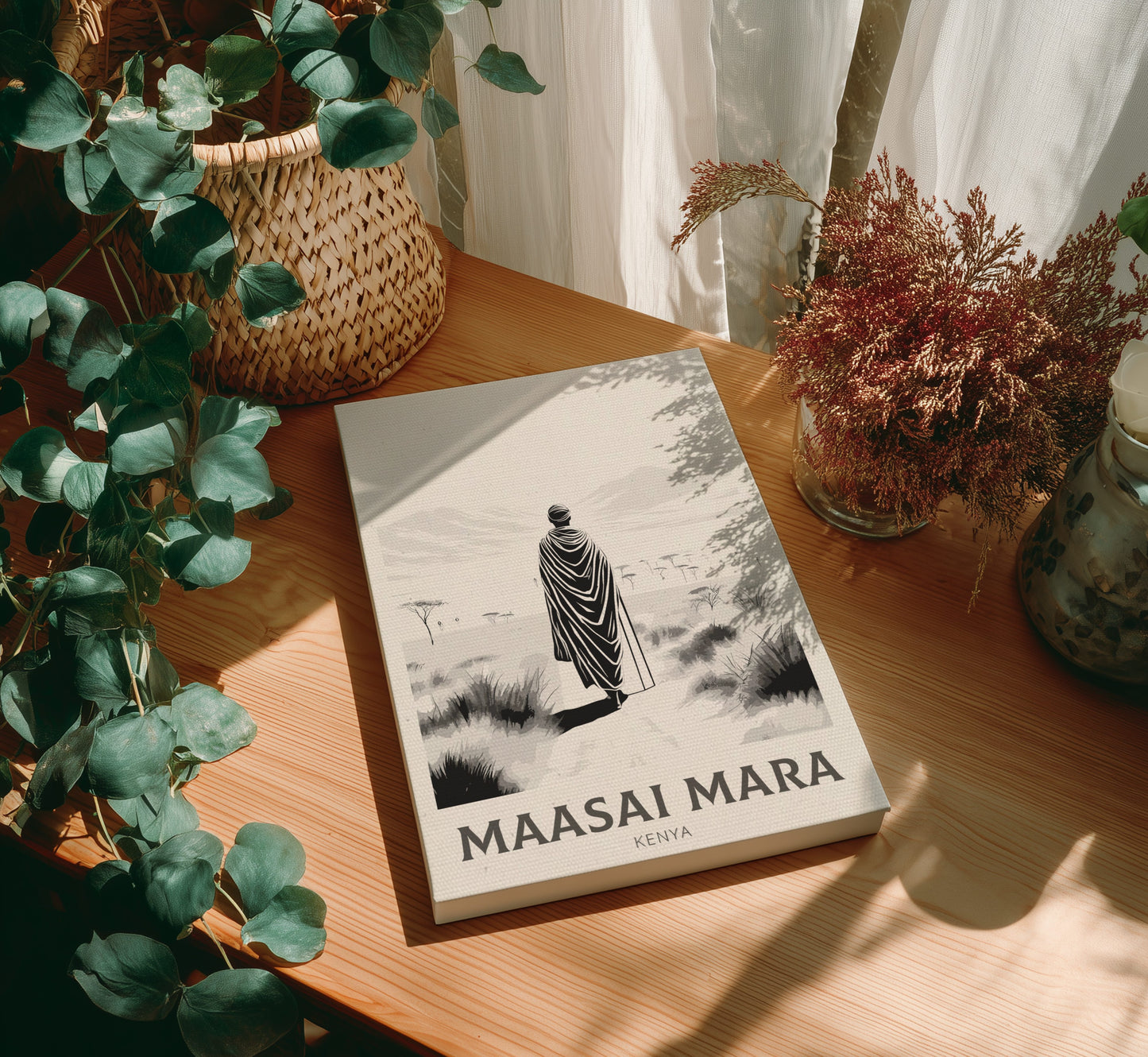 Canvas of 'Maasai Mara' on a wooden table with plants around