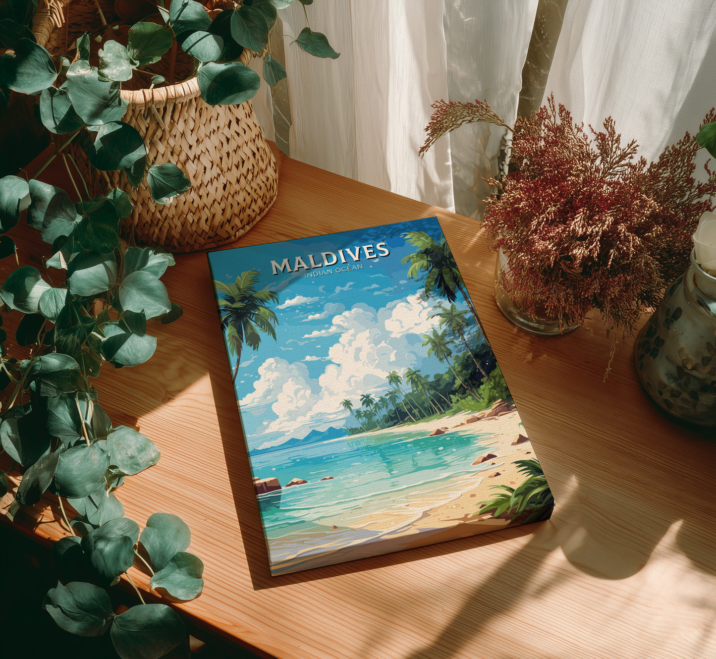 Book titled 'Maldives' on a wooden table with plants around