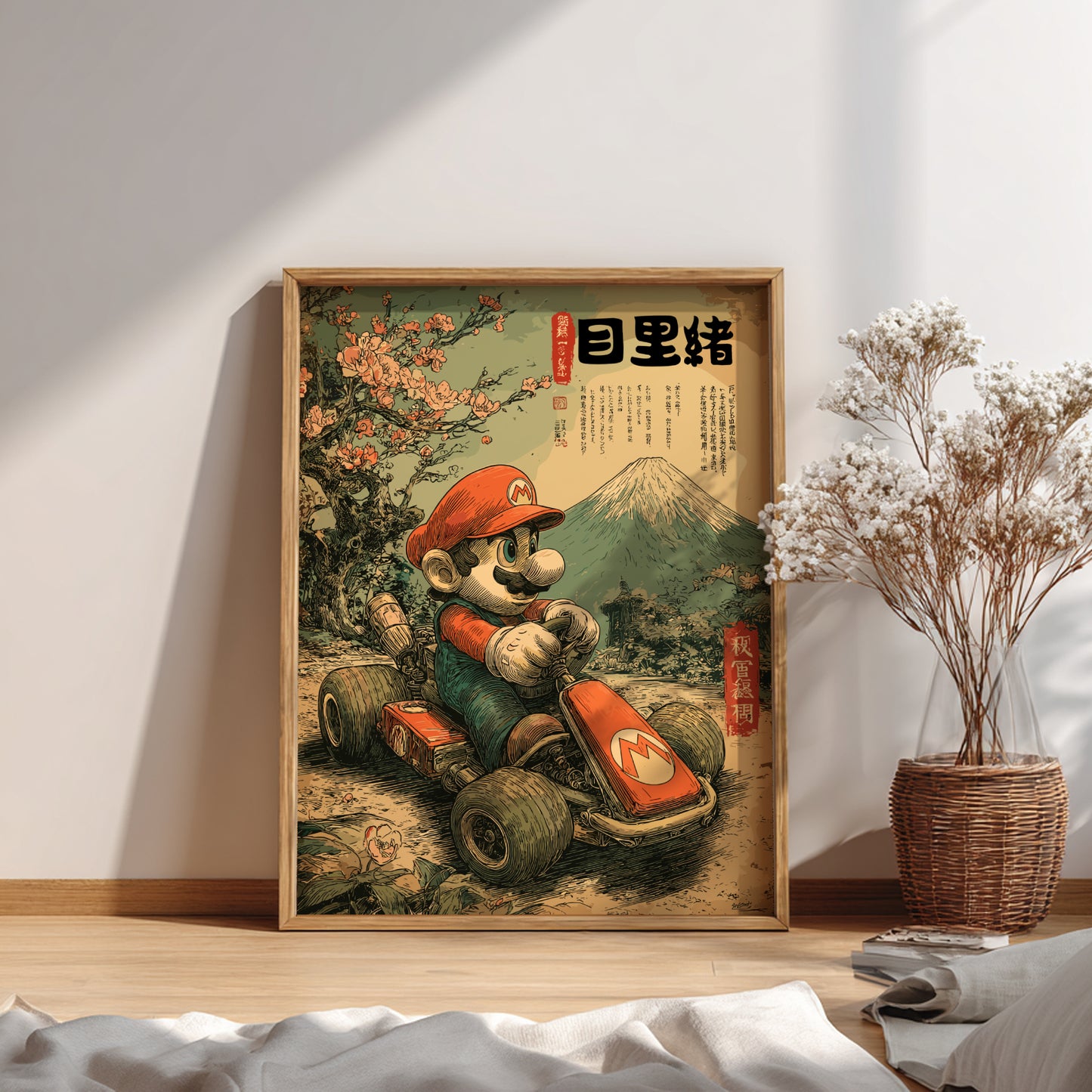 Framed artwork of Super Mario on a go-kart with a mountain and cherry blossoms in the background, placed on a wooden floor.