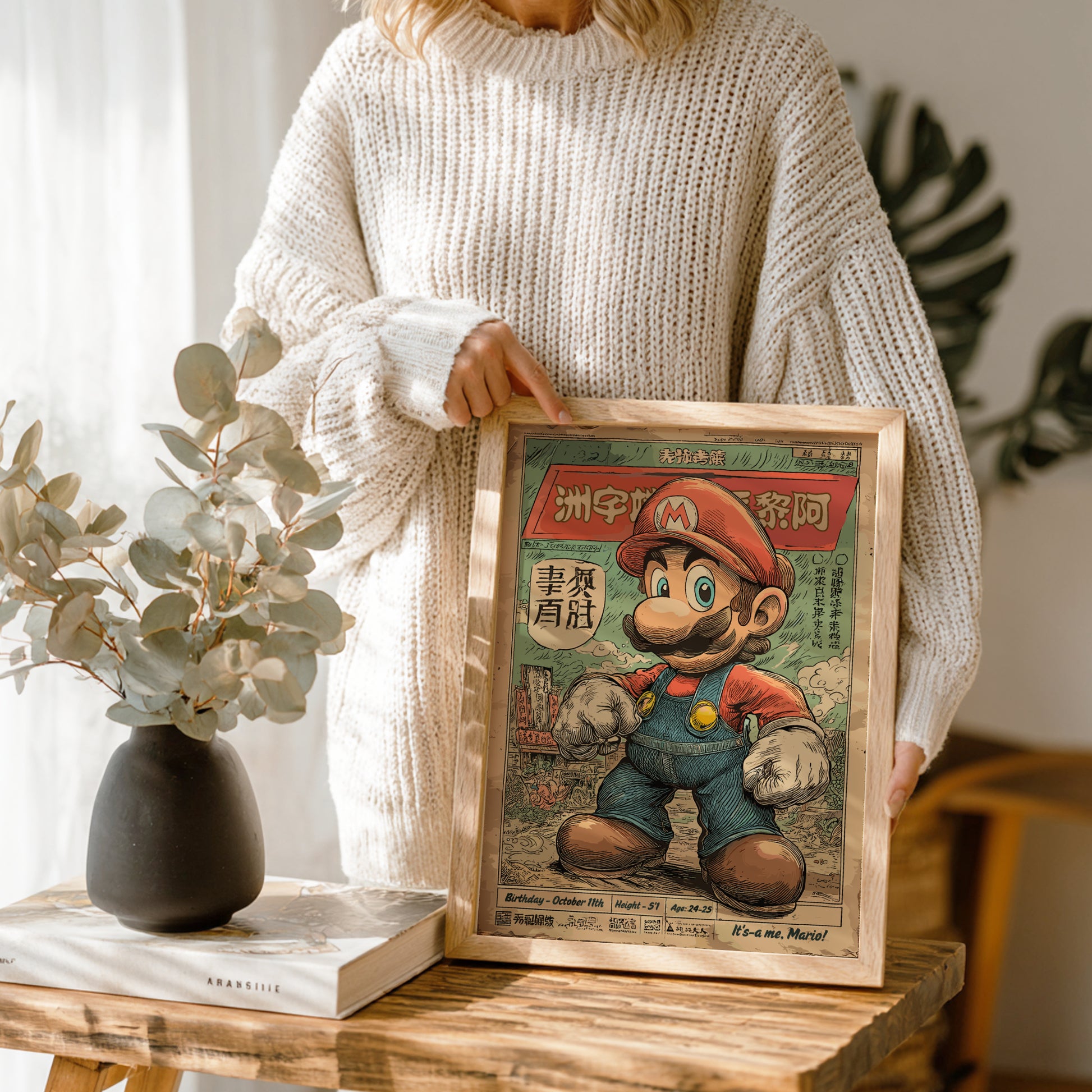 Person holding a framed illustration of Super Mario in a room with plants and decor.