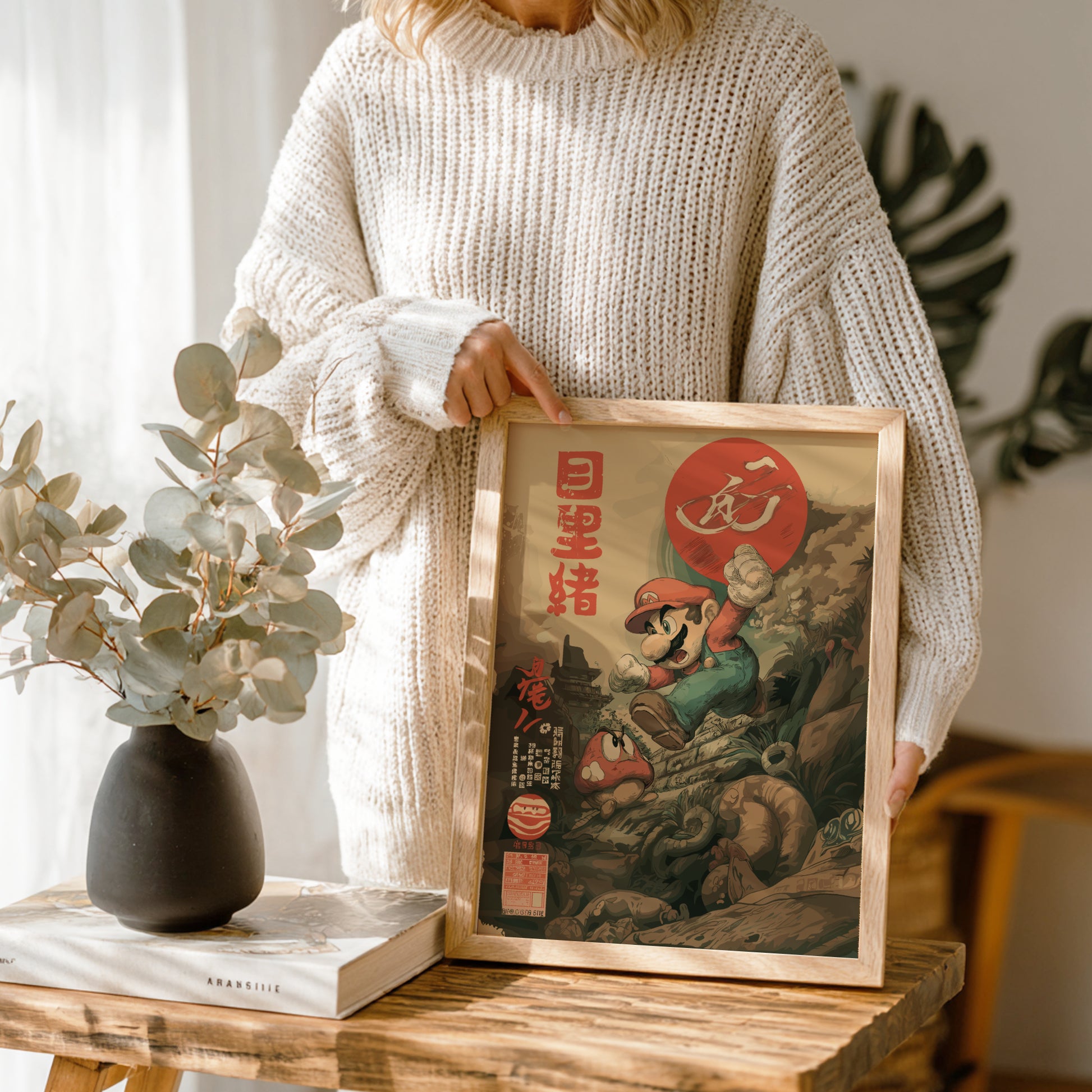 Person holding a framed picture of Super Mario in a home setting