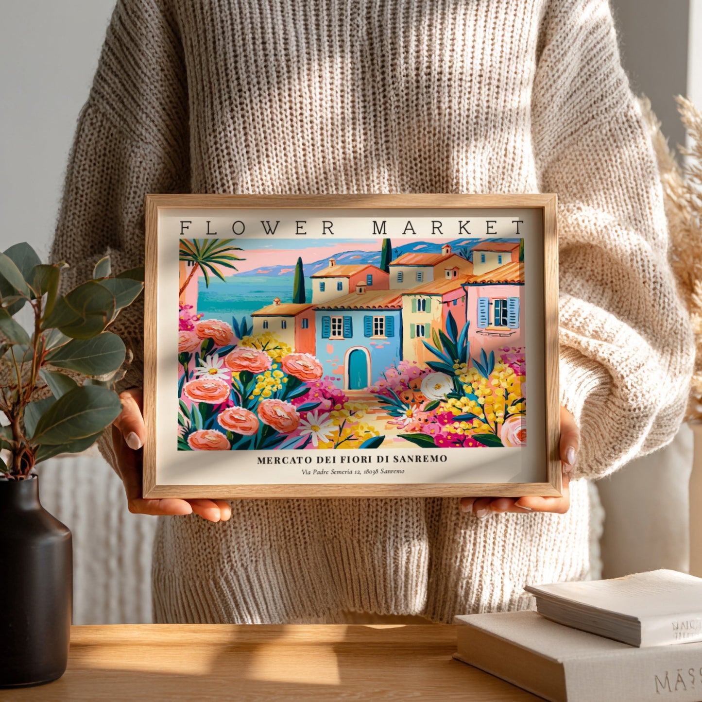 Flower market poster featuring vibrant pink roses and a coastal town scene in bright colors