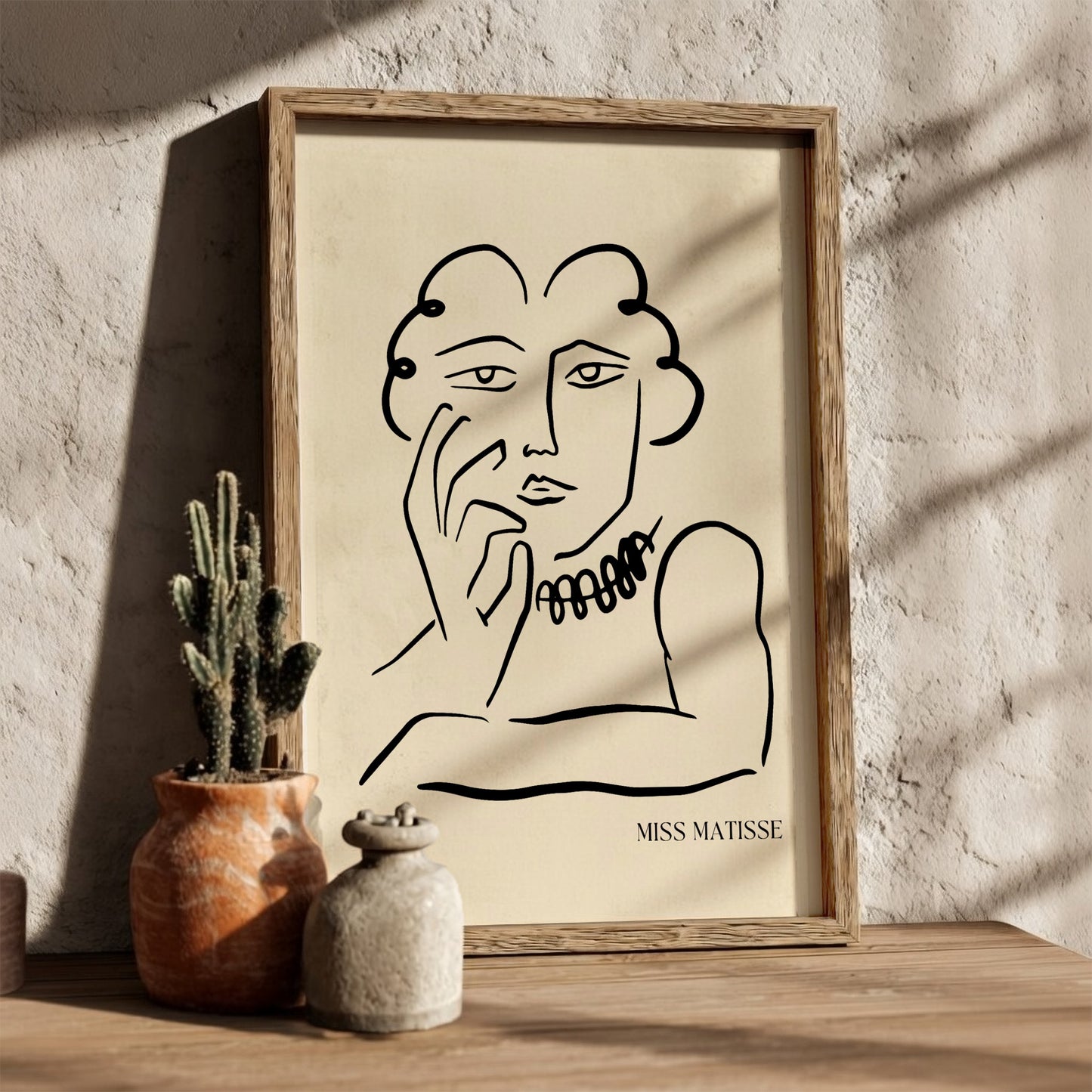 Miss Matisse line art poster featuring a portrait with a beaded necklace on a cream background.