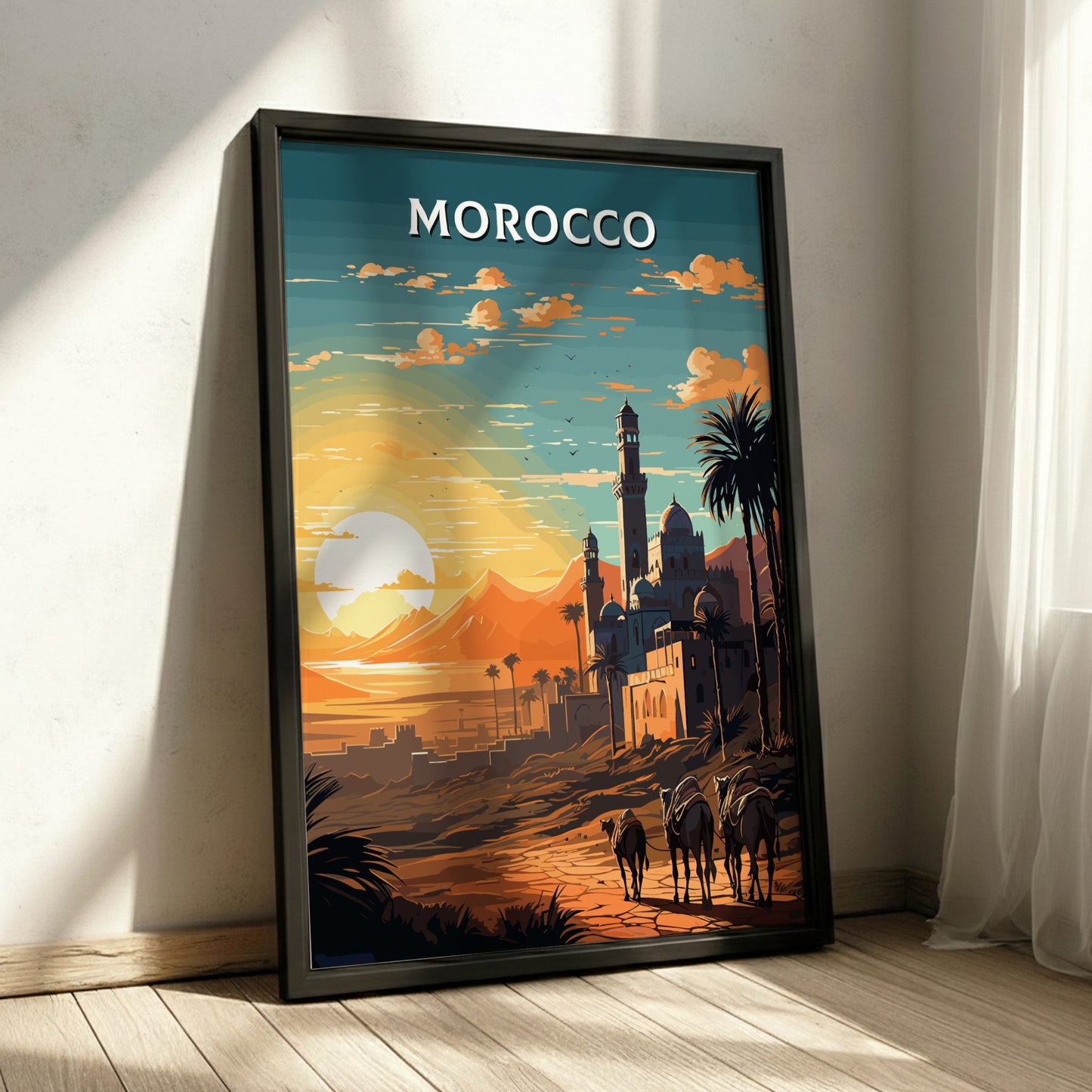 Framed artwork of a Moroccan landscape with a sunset and minaret, titled 'Morocco'.