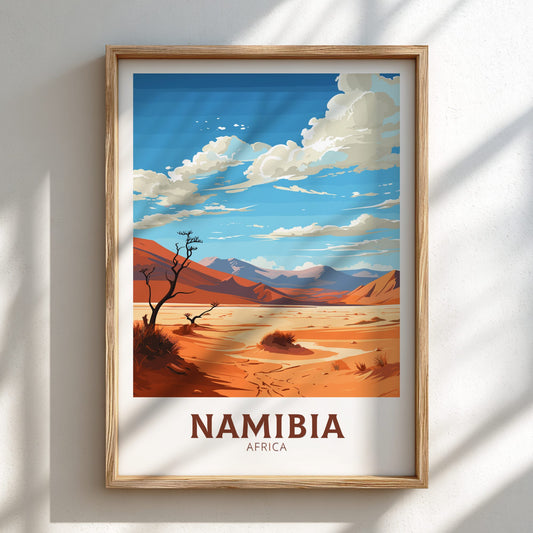 Framed artwork of a desert landscape with mountains and 'Namibia, Africa' text on a white wall.