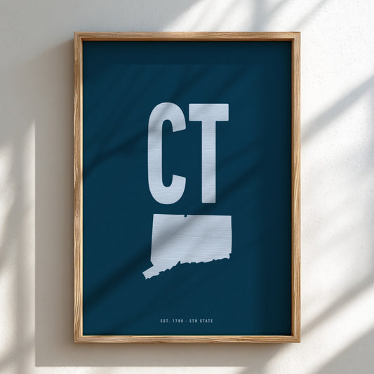 Framed artwork with 'CT' on a blue background