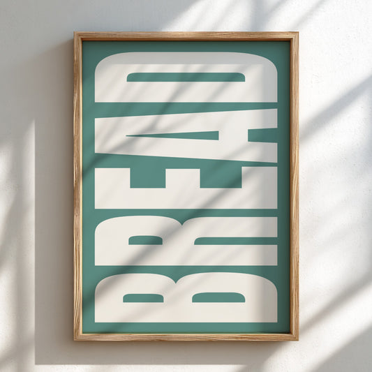 Framed artwork with 'BREAD' text on a teal background