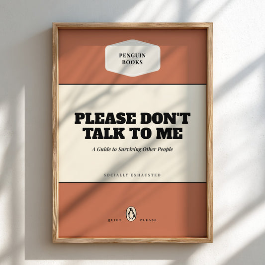 Framed book cover with 'Please Don't Talk to Me' text on a white wall.