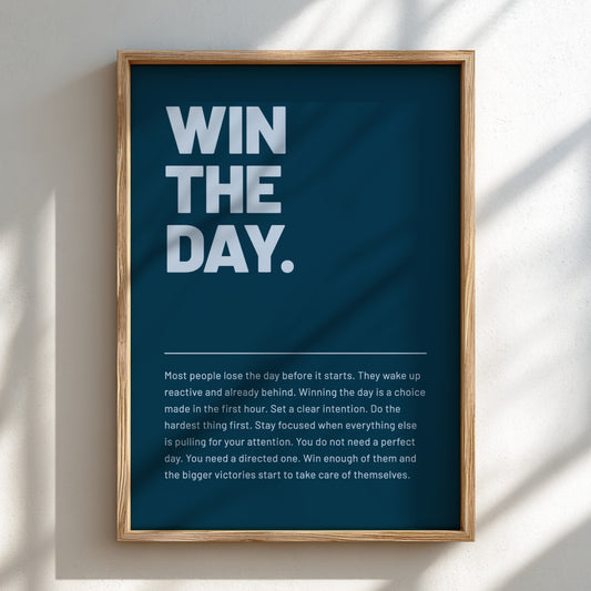 Framed motivational poster with 'WIN THE DAY.' text on a blue background