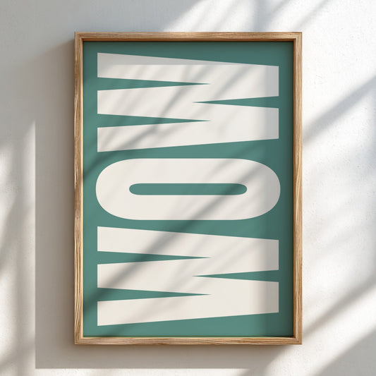 Framed artwork with the word 'WOW' on a teal background