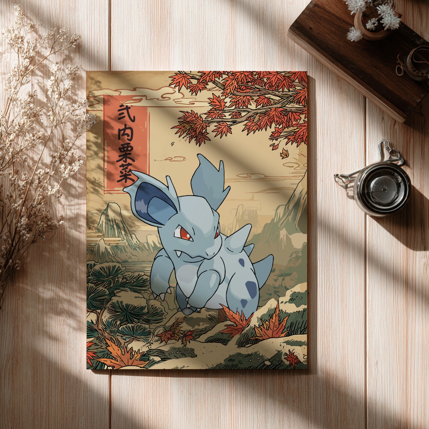 Nidorina Pokemon character on a decorative card with autumn leaves on a wooden surface