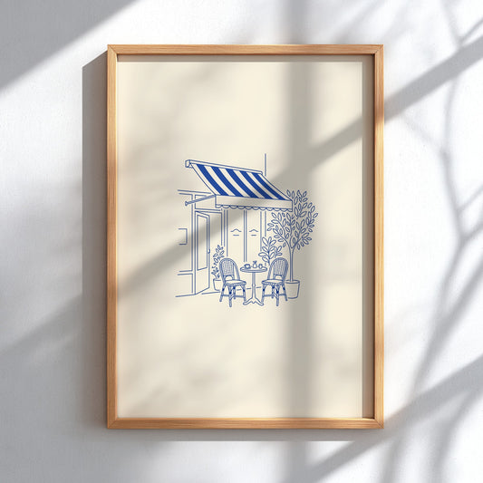 Poster featuring blue minimalist line art of a Parisian cafe with bistro chairs.