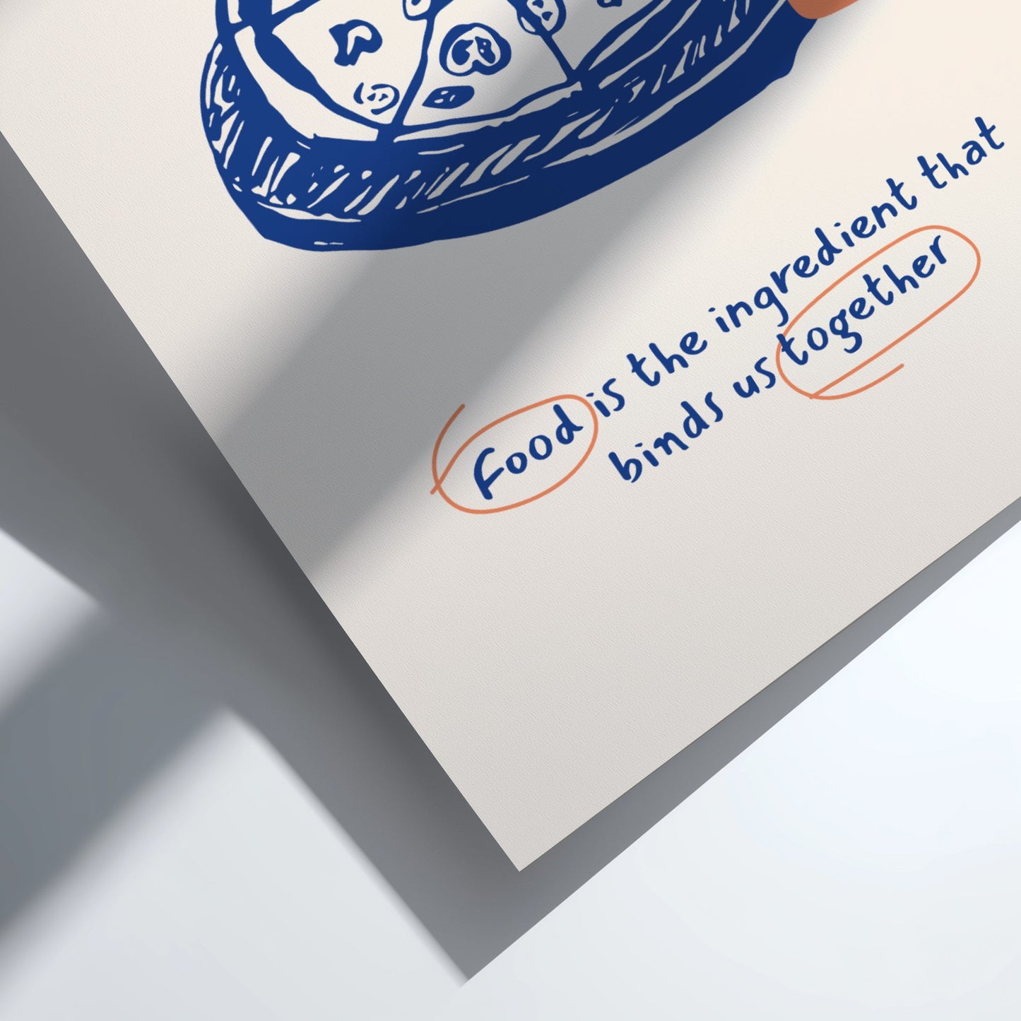 Notebook with a quote about food binding us together, featuring a blue stamp on a white background.
