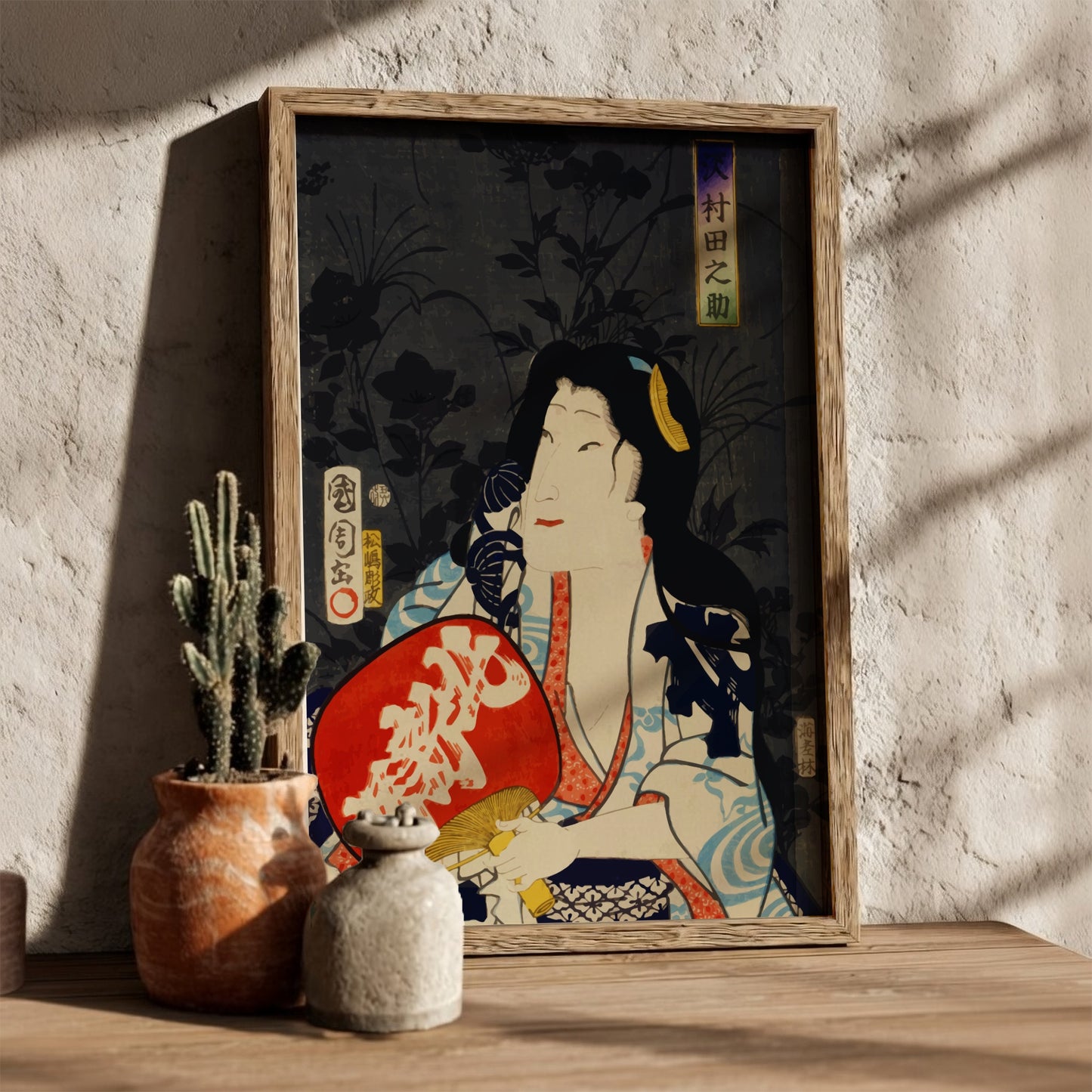 Poster of a Japanese actor portrait in ukiyo-e style by Toyohara Kunichika, featuring red fan.