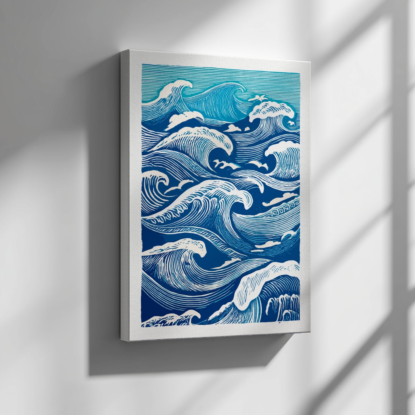 Framed artwork of blue and white wave patterns on a wall.