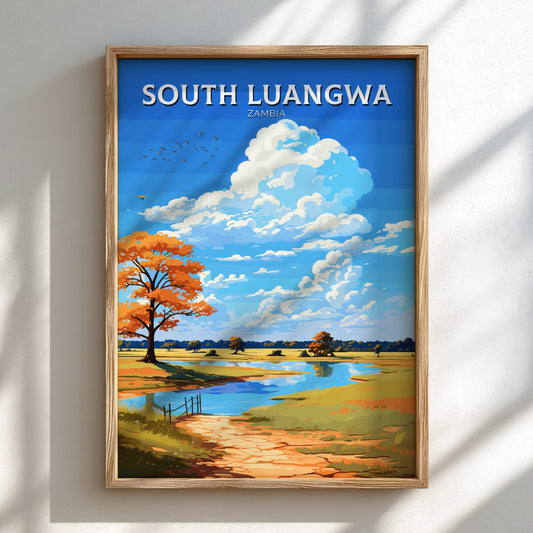 Framed artwork of a scenic landscape with 'South Luangwa Zambia' text on a white wall.