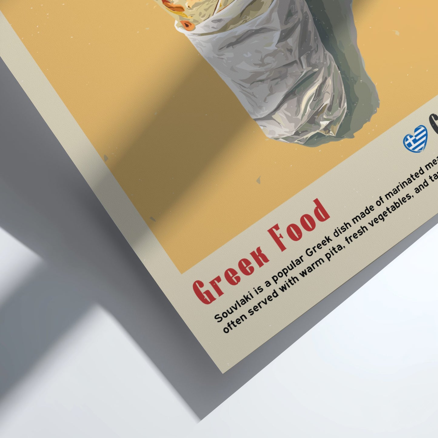 Close-up of a Greek food menu with a souvlaki dish and text on a yellow background.