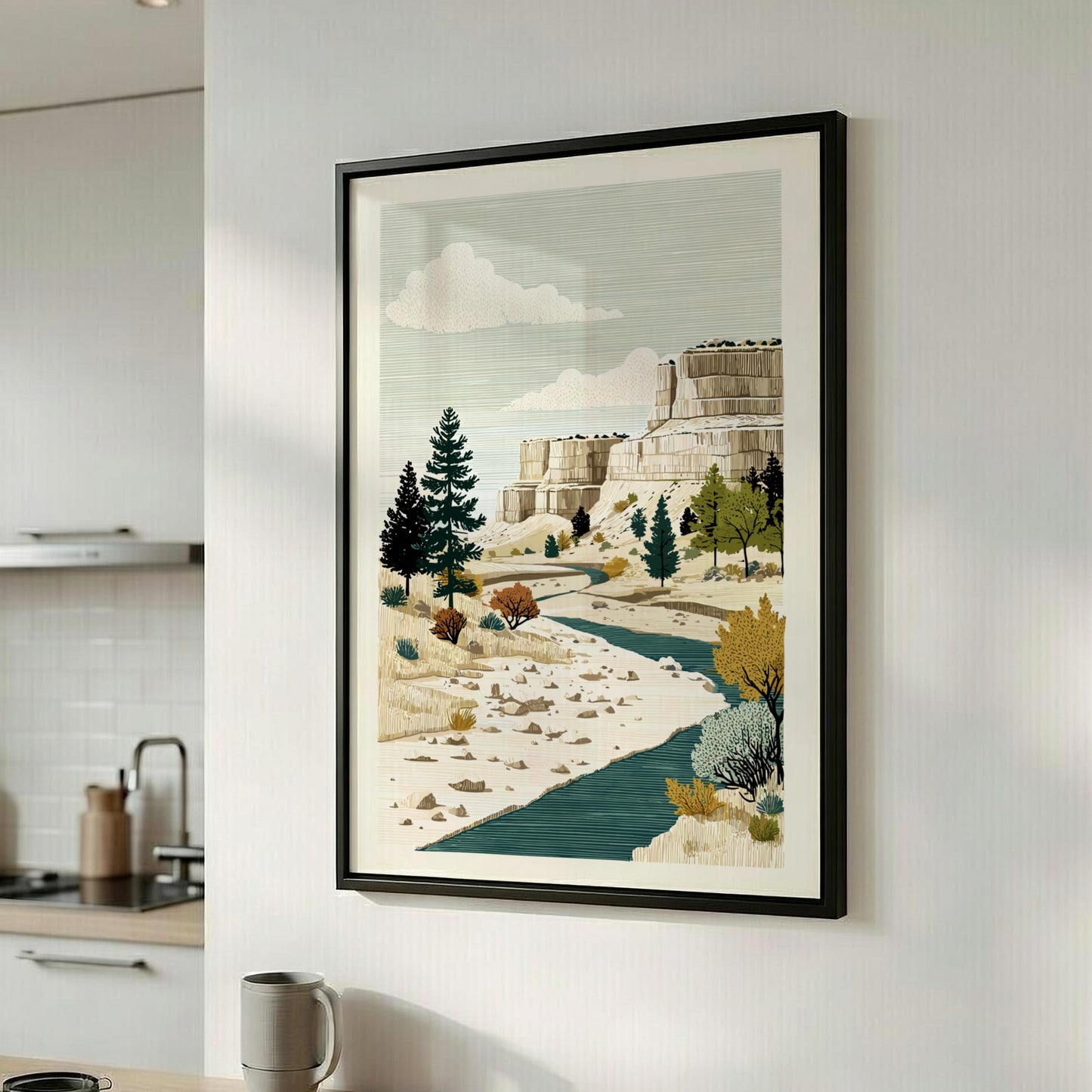 Framed landscape artwork on a wall in a kitchen