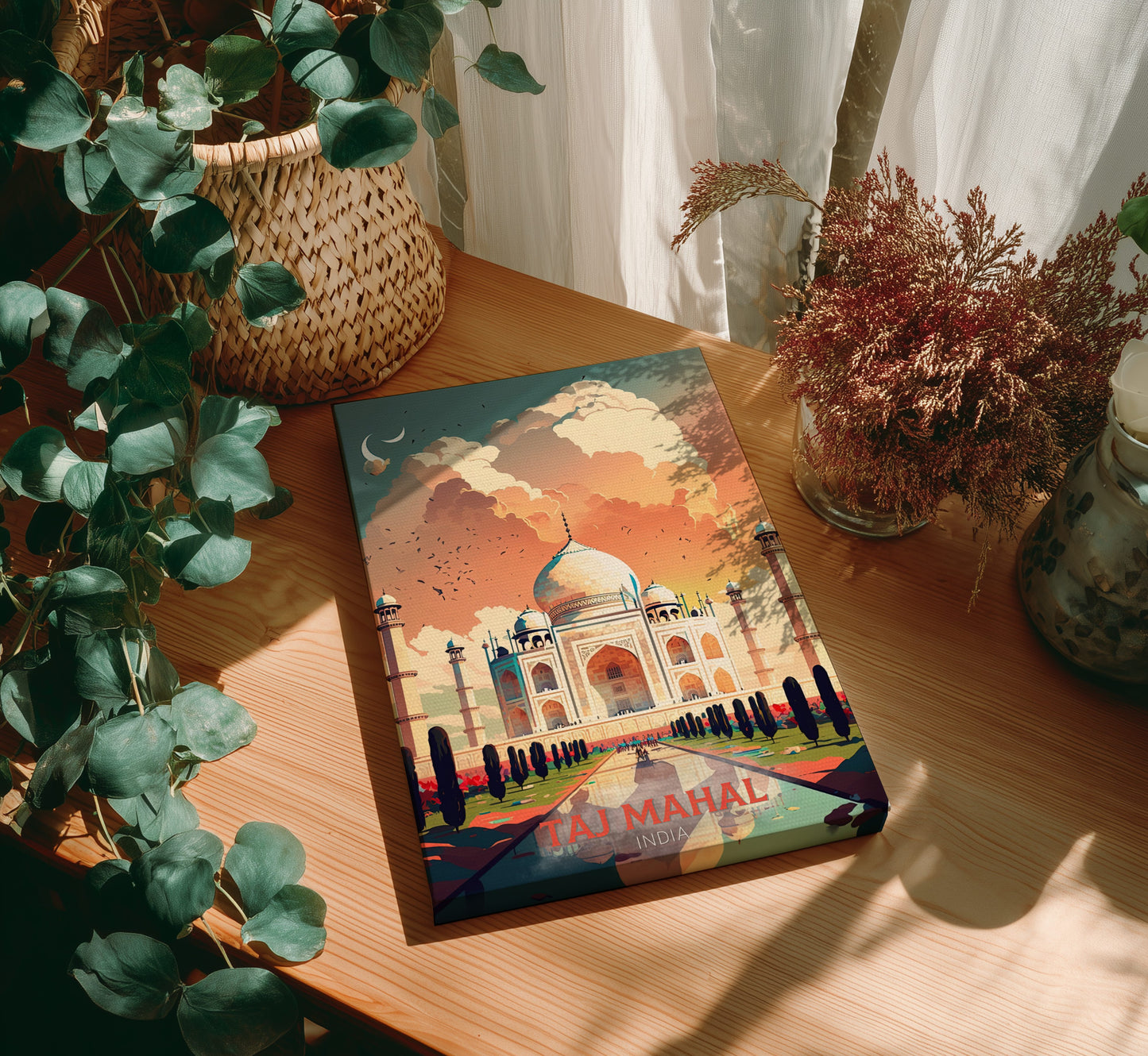 Colorful Taj Mahal poster on a wooden table with plants and decor.