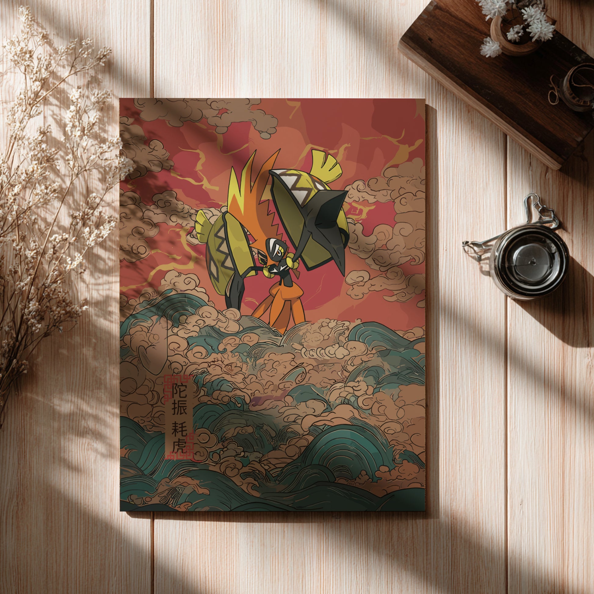 Notebook with a colorful illustration of Tapu Koko Pokemon on a wooden surface