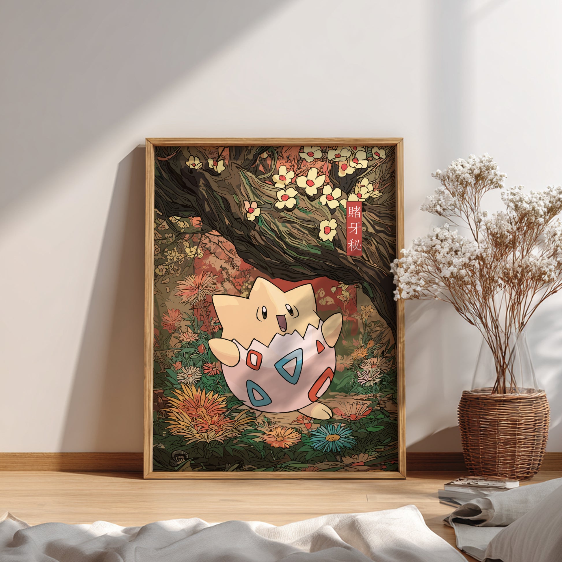 Framed artwork of Togepi Pokemon in a natural setting on a wall.