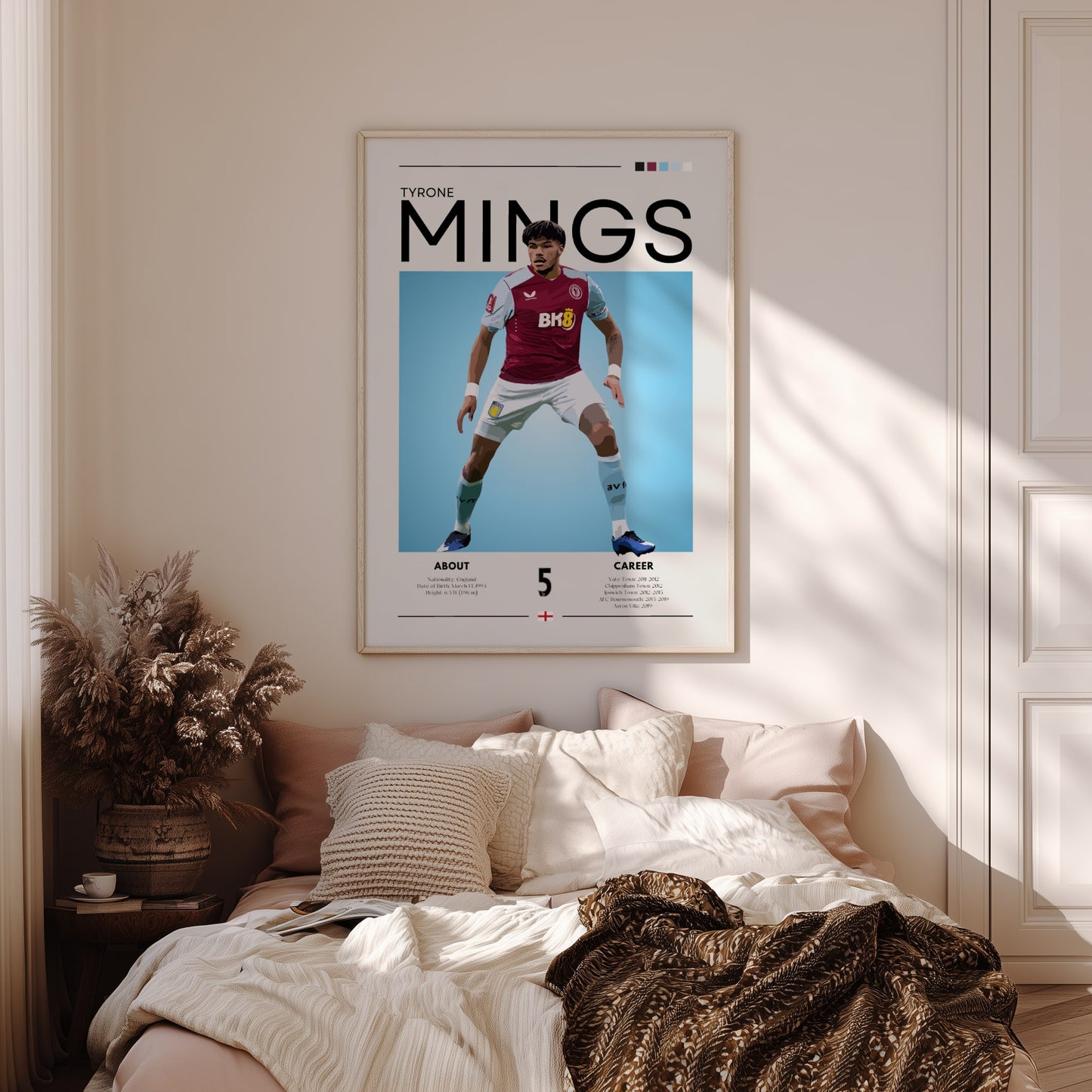 Framed sports poster of a player on a wall above a bed in a bedroom.