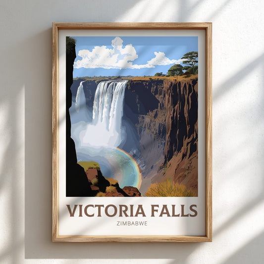 Framed poster of Victoria Falls with a rainbow, set against a white wall.