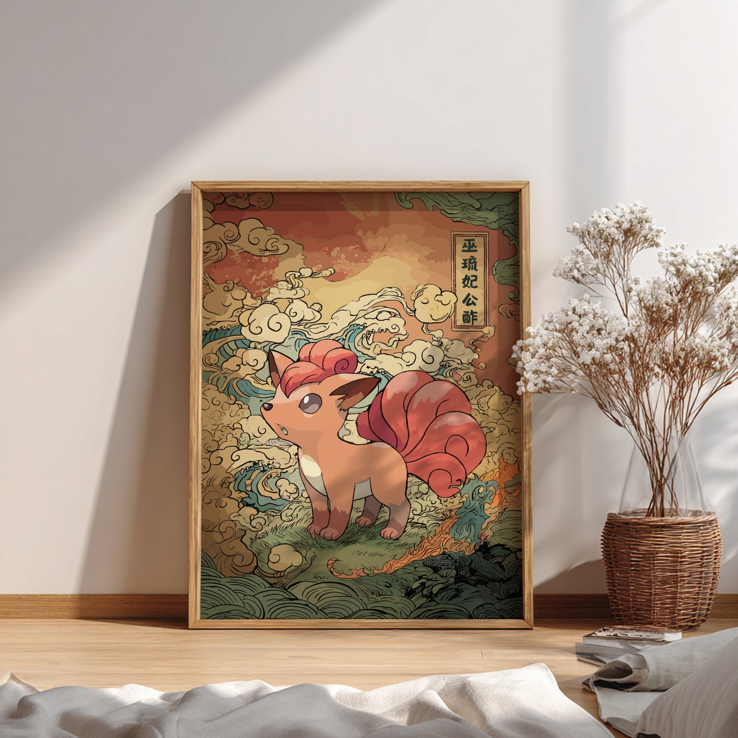 Framed artwork of Vulpix Pokemon on a wall in a room.